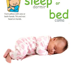 A baby sleeping on a bed with the Bedtime Signs Poster Pack.