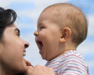 Mom and baby smiling