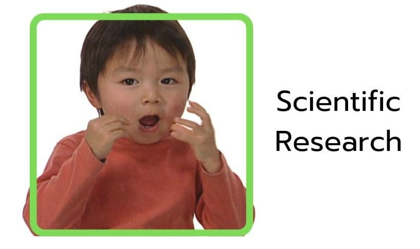 Child demonstrating sign language representing research on baby sign language and early communication development