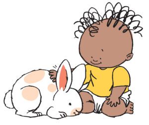 A child, of black ethnicity, happily playing with a cute white bunny.