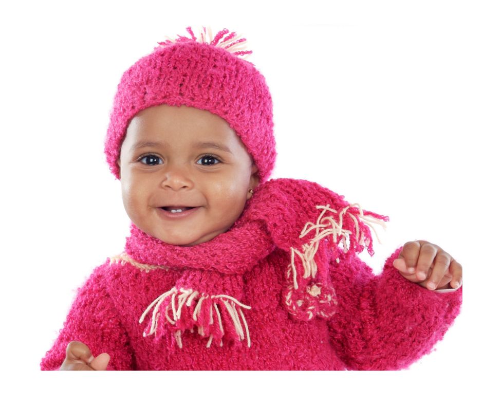 baby in pink with hat and scarf