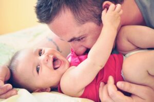 father with happy baby