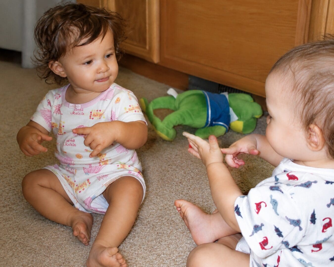 Two babies using the HURT sign with the Baby Signs Program