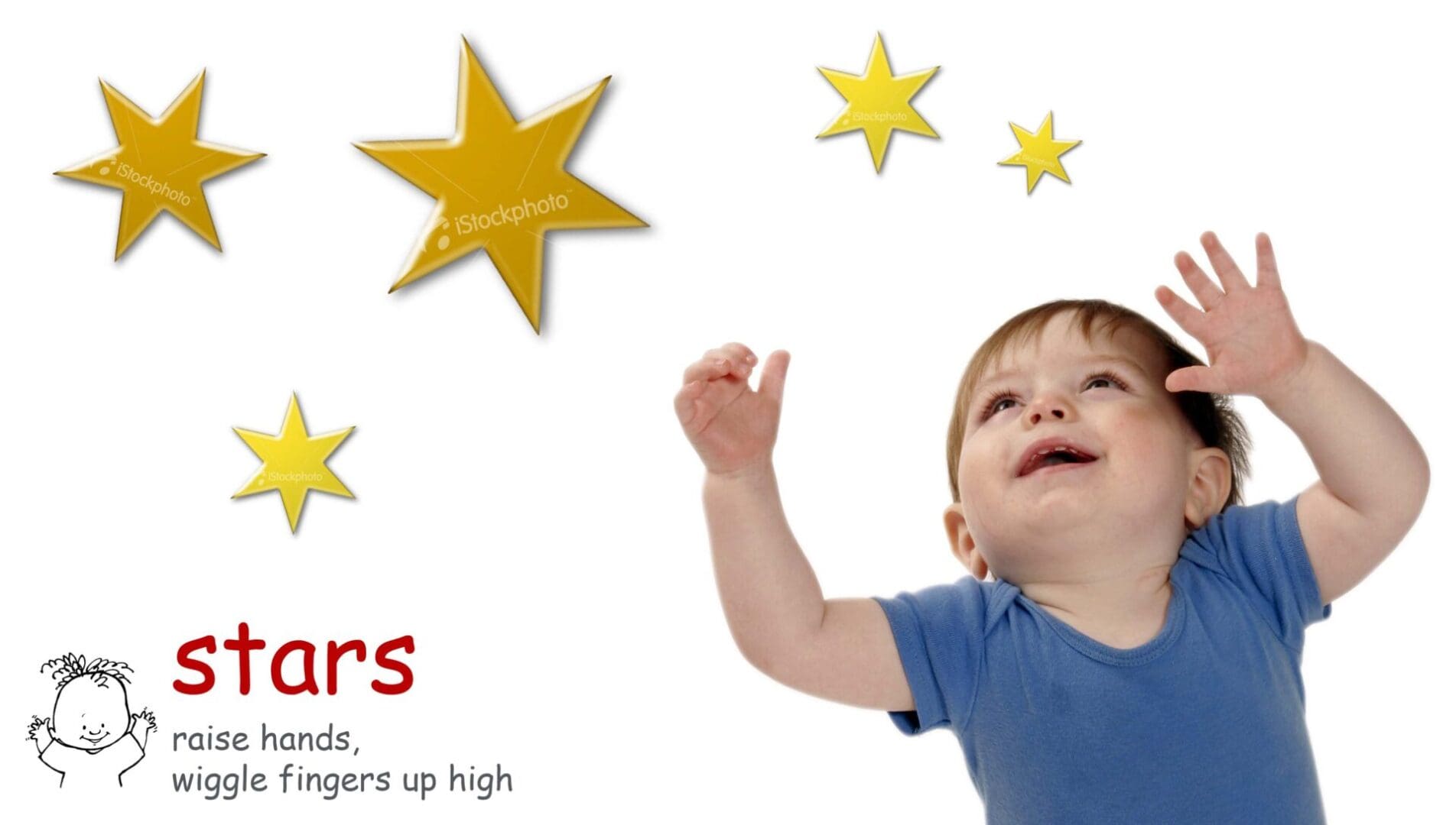 Baby reaching for yellow stars.
