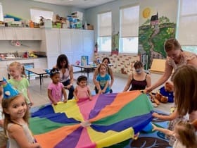 Certified Baby Signs® instructor leading a Baby Signs® class with young children using interactive play