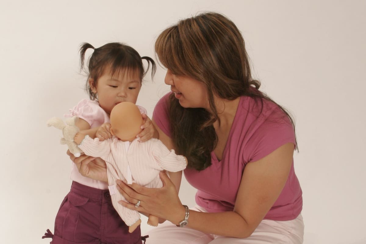 parent and baby using play to build early communication and language development